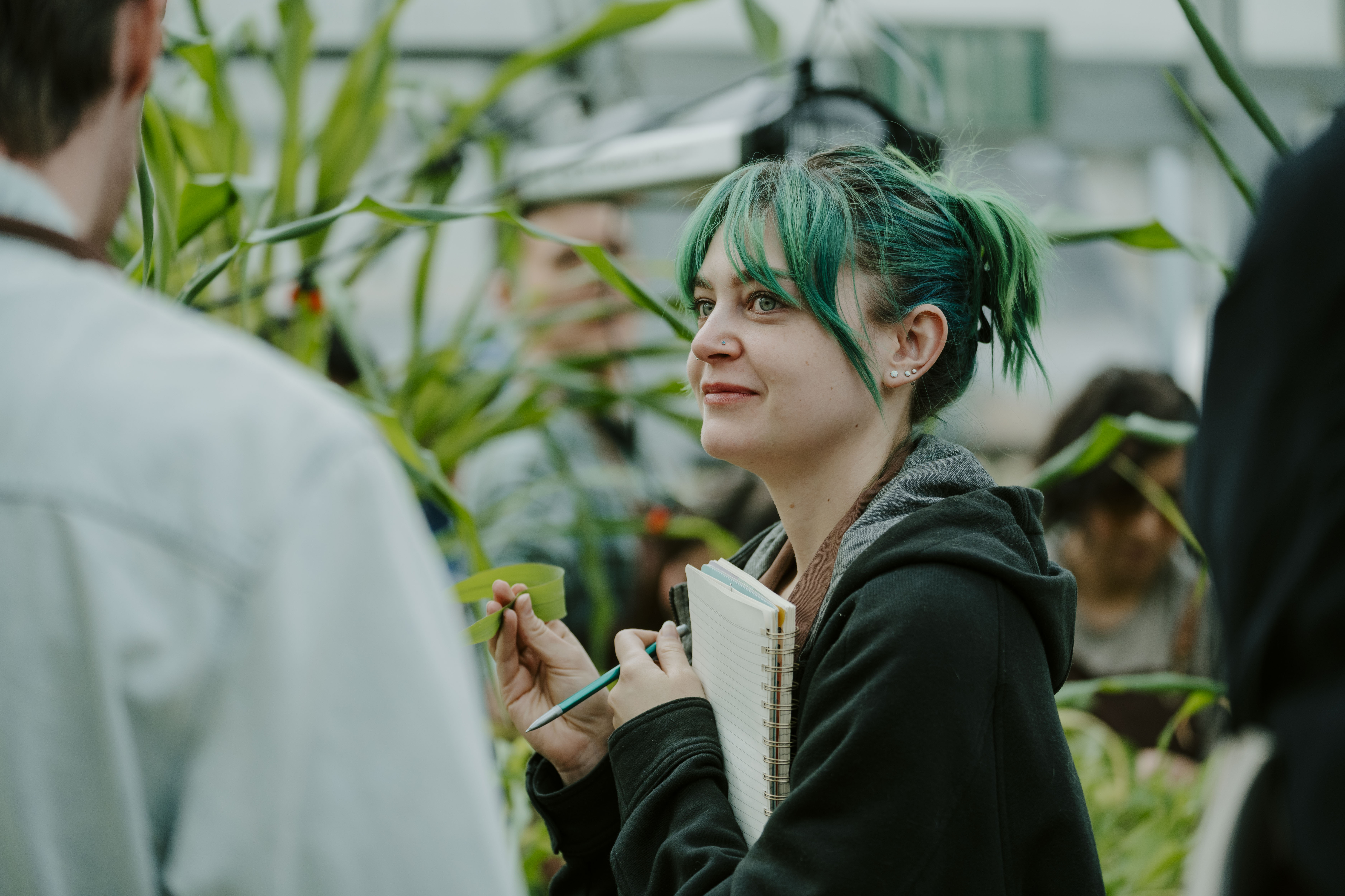 students in greenhouse for class