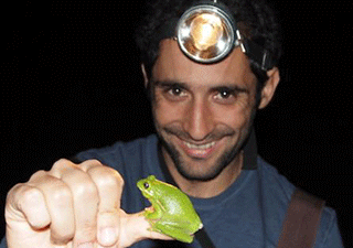 Professor Vélez with a small frog on his thumb