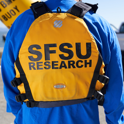 SF State affiliate wearing a SFSU Research life vest.
