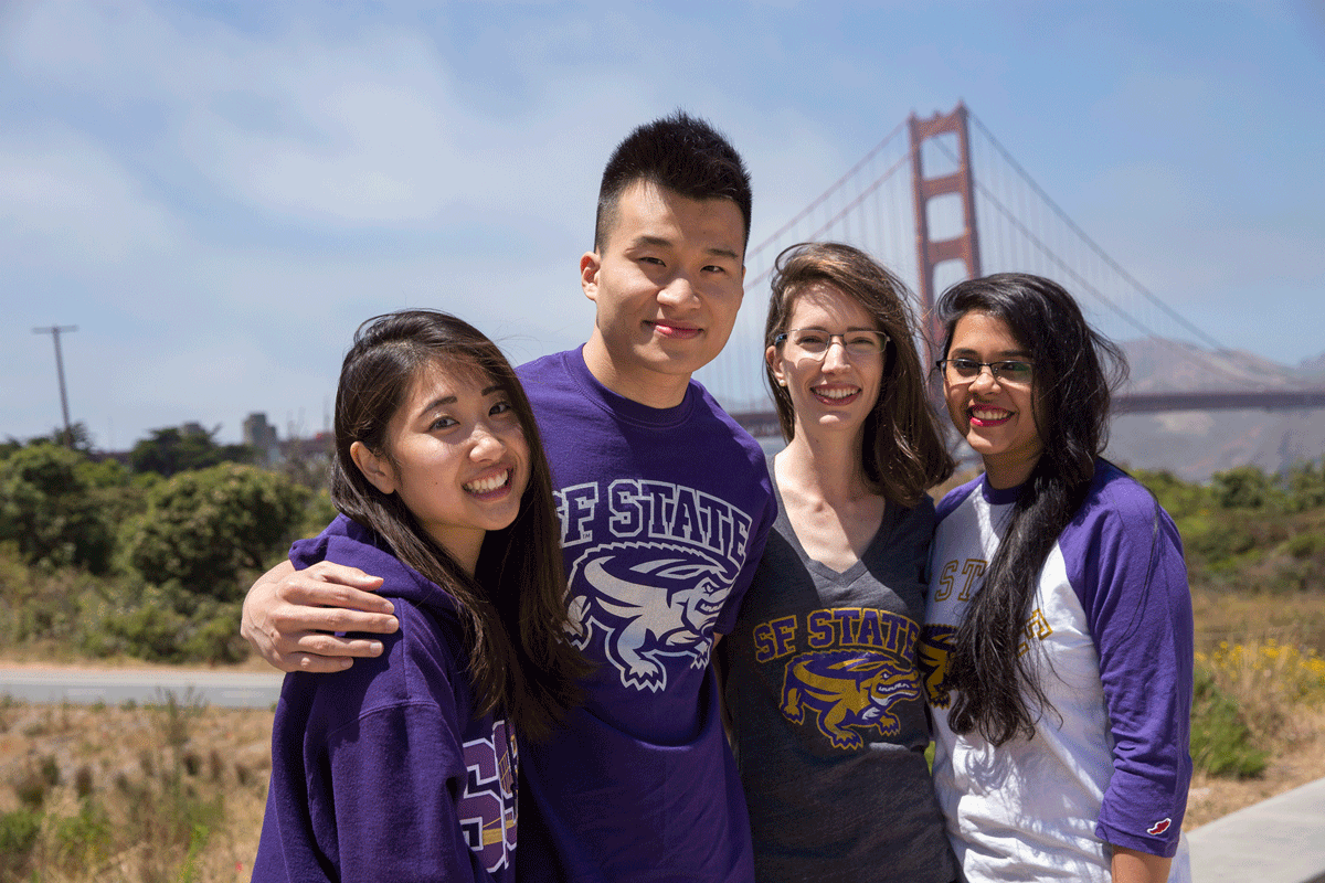 International students in SF State gear at the Golden Gate Bridge in San Francisco