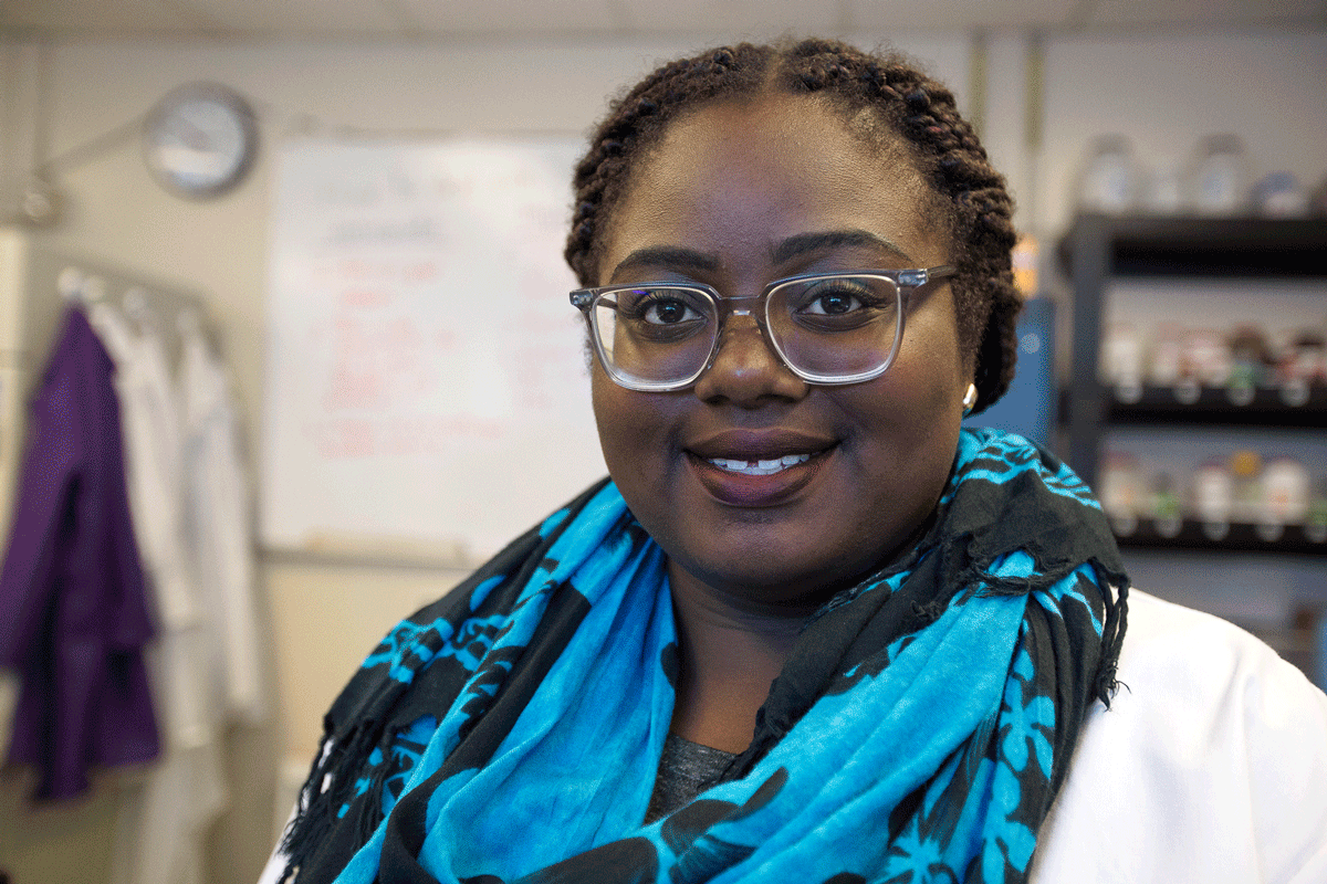 Scientist wearing a vibrant blue scarf