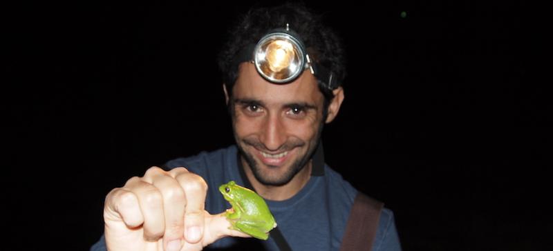 Professor Vélez with a small frog on his thumb